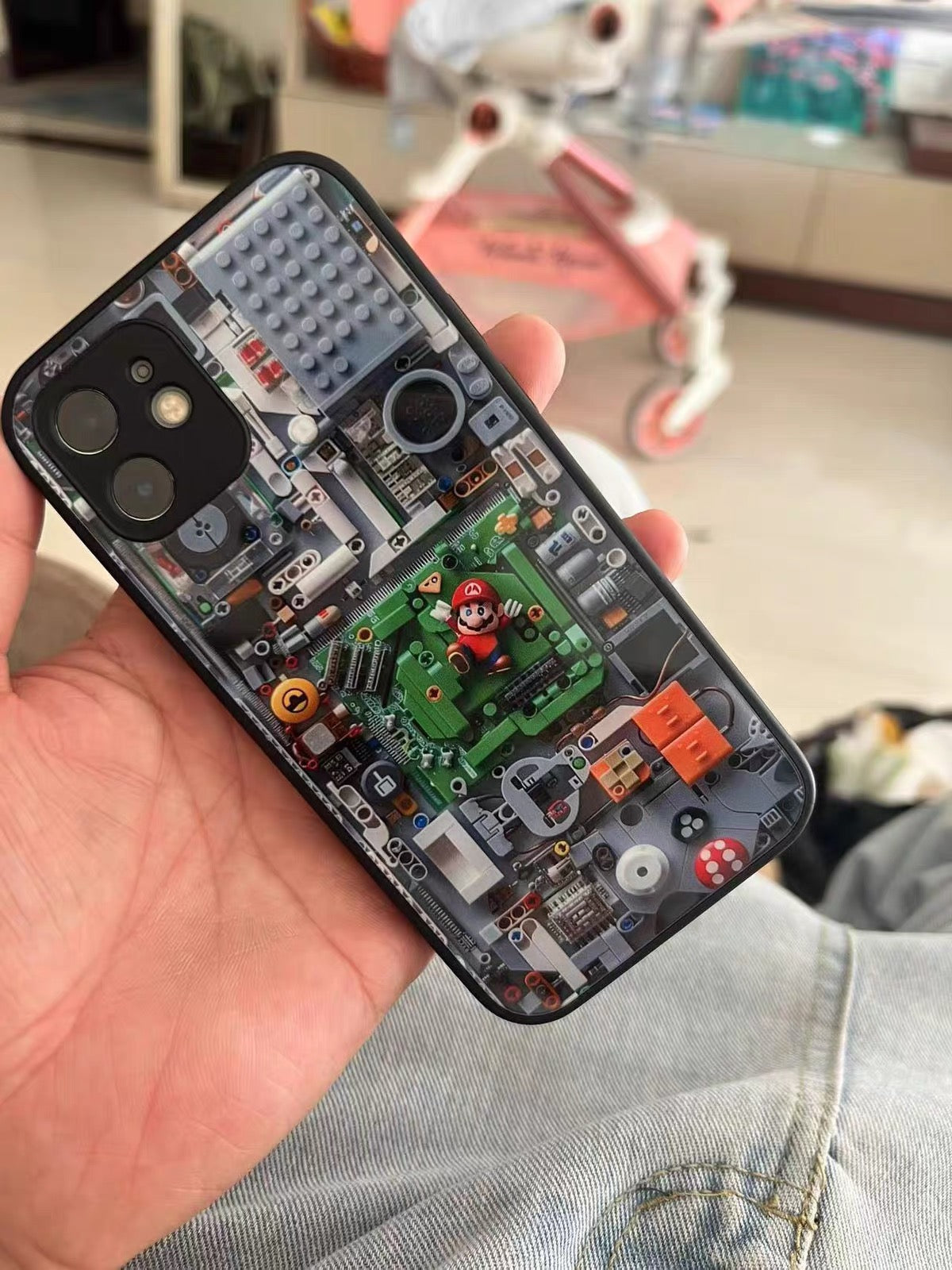 Phone case with electronic circuit design held by a person