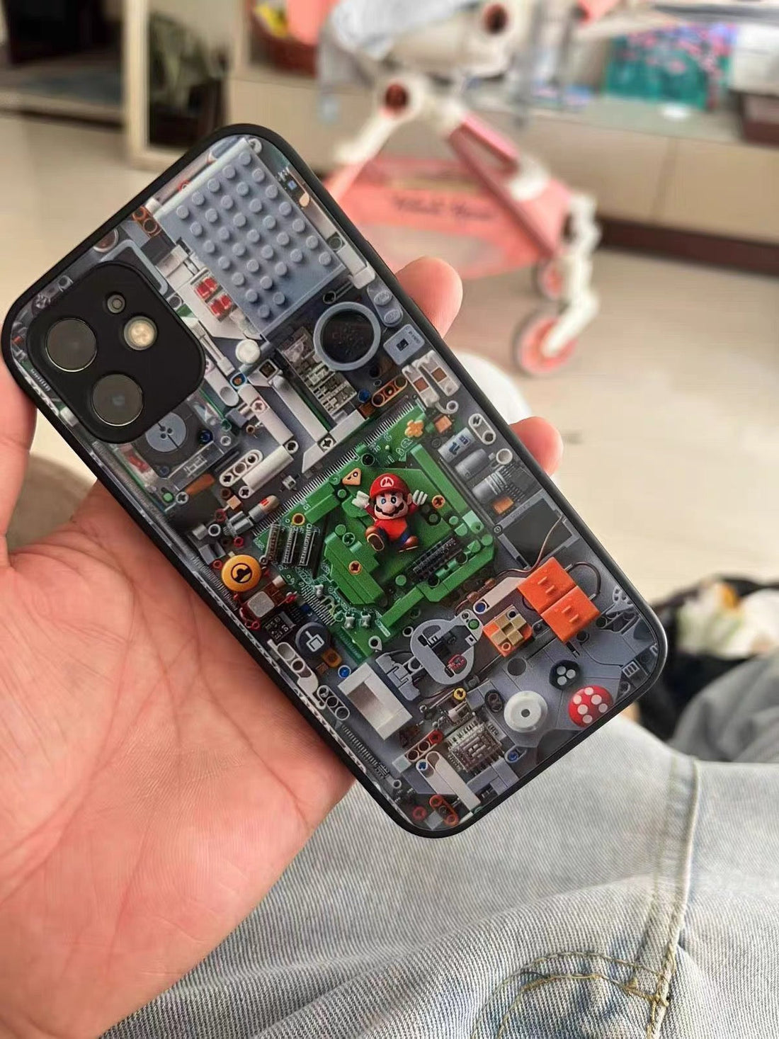 Phone case with electronic circuit design held by a person