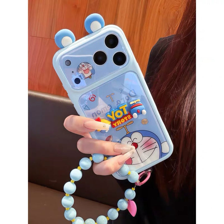 Phone case with cartoon design held by a person, featuring a character and text.