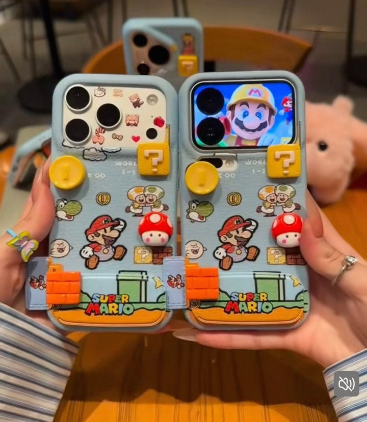 Two phone cases with Super Mario design held by a person.